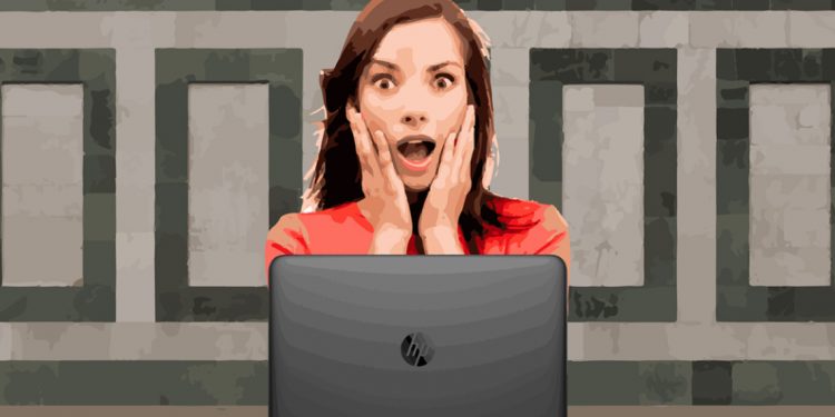 Surprised woman in front of computer